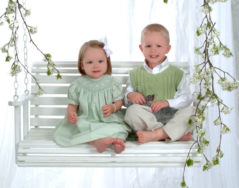 Boy and Girl on Swing with Bunny