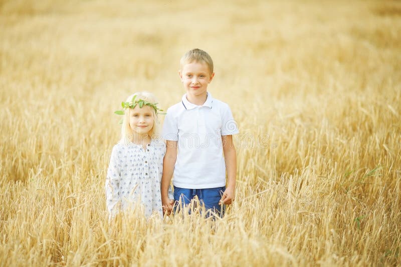 boy and girl in wheat field