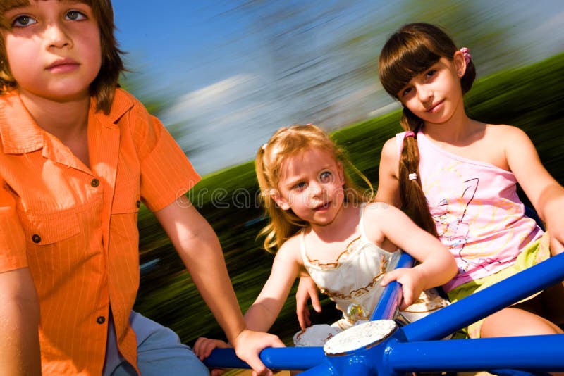 Boy and girls on carousel