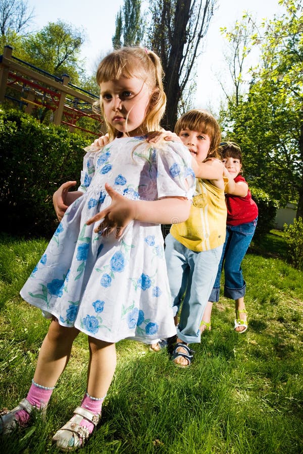 Boy with girls in park