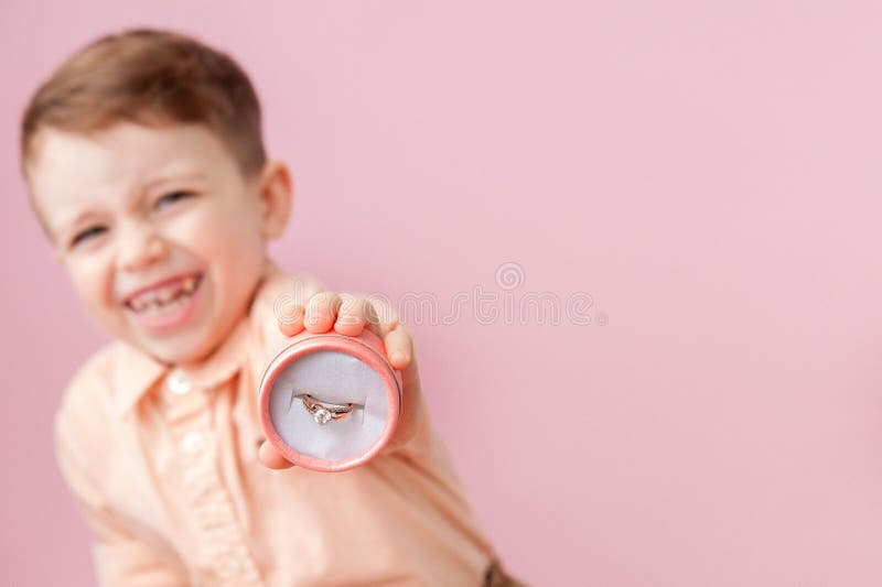 Boy Giving Ring in Box on Pink Background Stock Photo Image of couple
