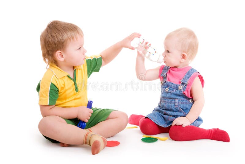 Boy giving to drink to a girl