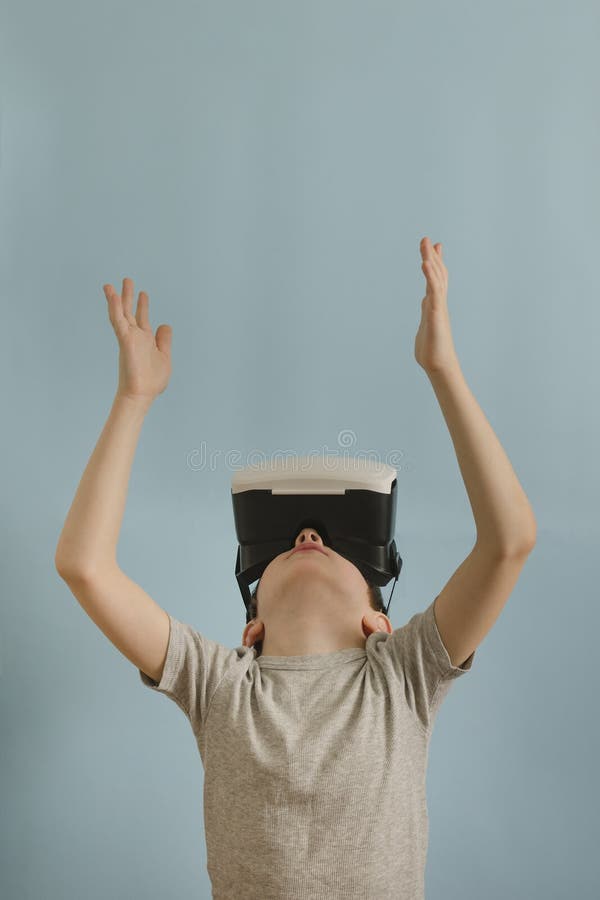Boy With Glasses Of Virtual Reality Hands Up Blue