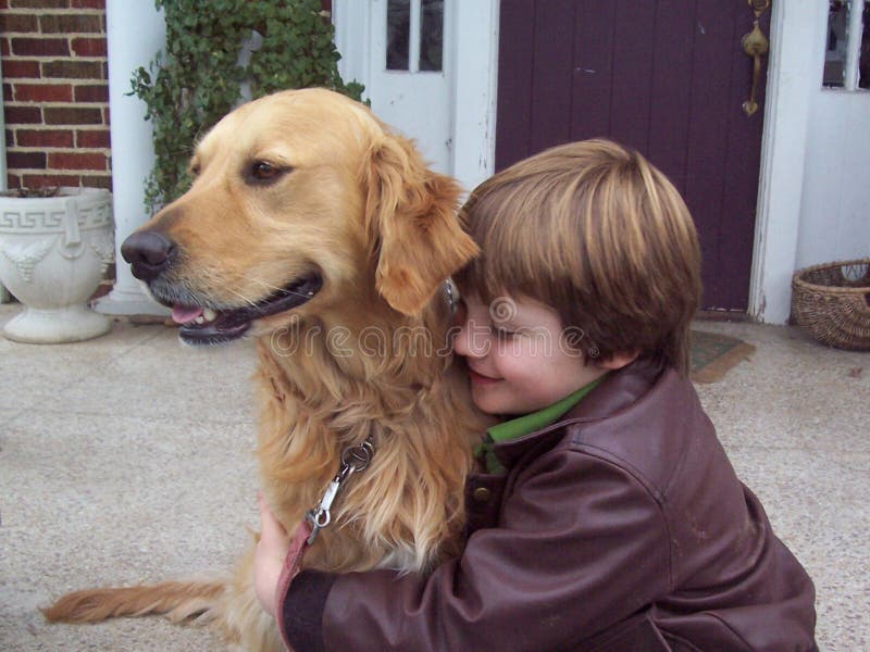 Boy and golden retriever portrait