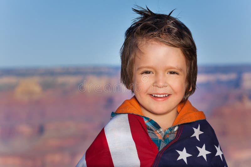 Boy with Grand Canyon National Park and USA flag royalty free stock photography Boy with Grand Canyon National Park and USA flag royalty free stock photography