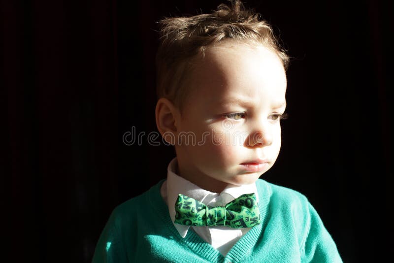 Boy in green cardigan and white shirt royalty free stock photography Boy in green cardigan and white shirt royalty free stock photography
