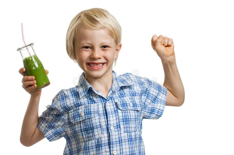 A cute boy holding a bottle of green smoothie or juice is flexing his muscles and smiling. Isolated on white. A cute boy holding a bottle of green smoothie or juice is flexing his muscles and smiling. Isolated on white.