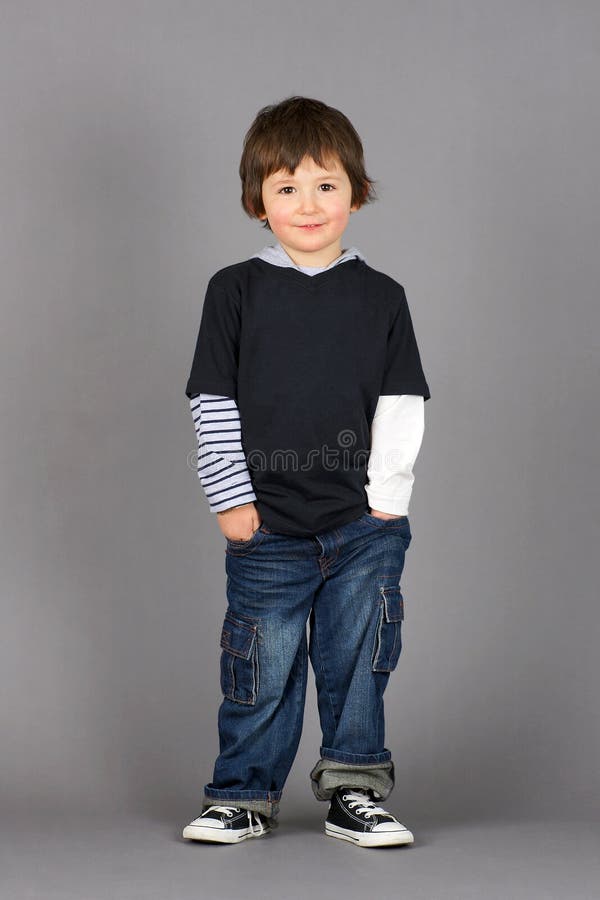 Boy with hands in pockets stock image. Image of beautiful 22957183