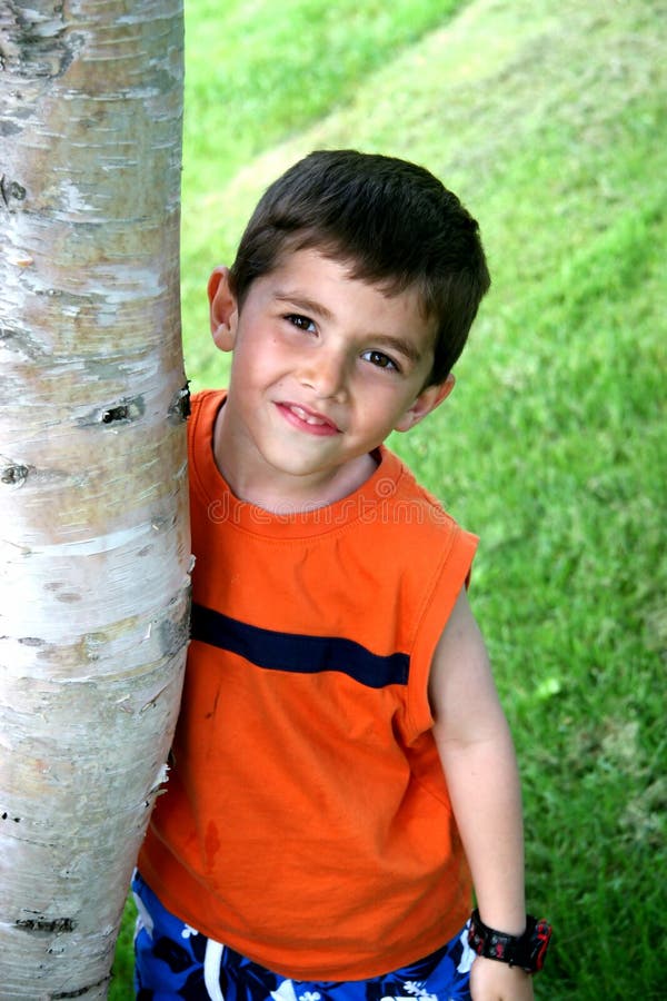 Boy hanging out around Tree