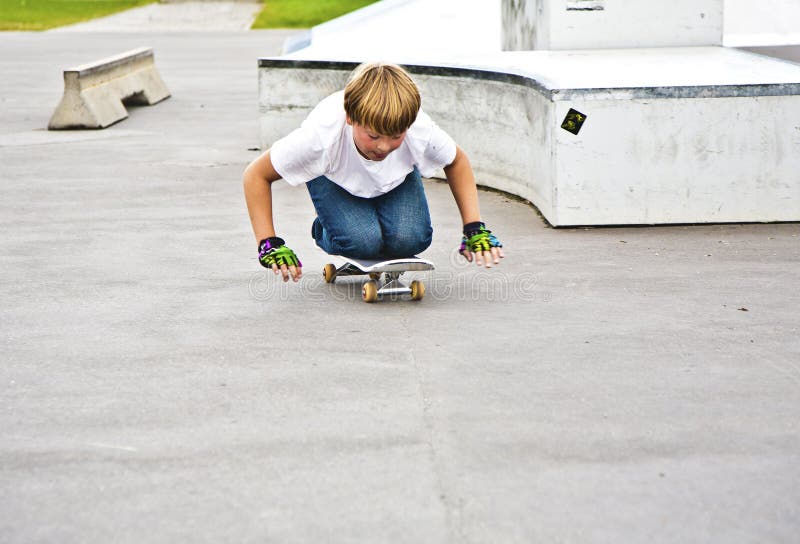 Boy Has Fun Skating on Knees Stock Photo Image of hair, exercise