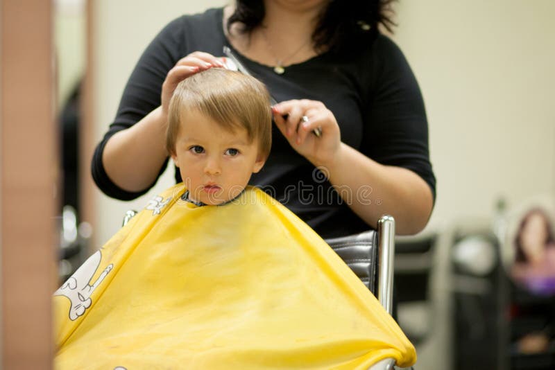 Boy, having hair cut in the barber shop. Cut smiling stock images, royalty-free photos and pictures