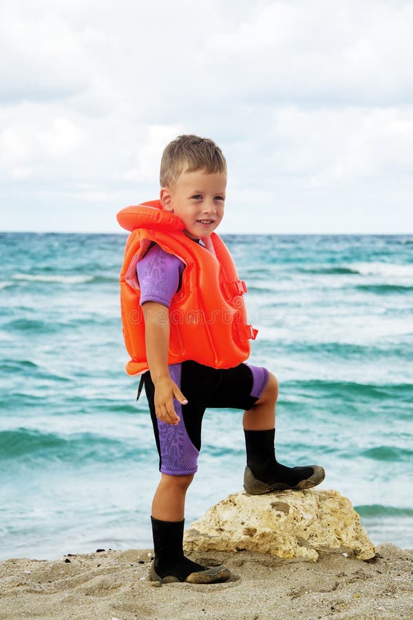 Boy in His Diving Suit and Life Jacket at Beach Stock Image Image of