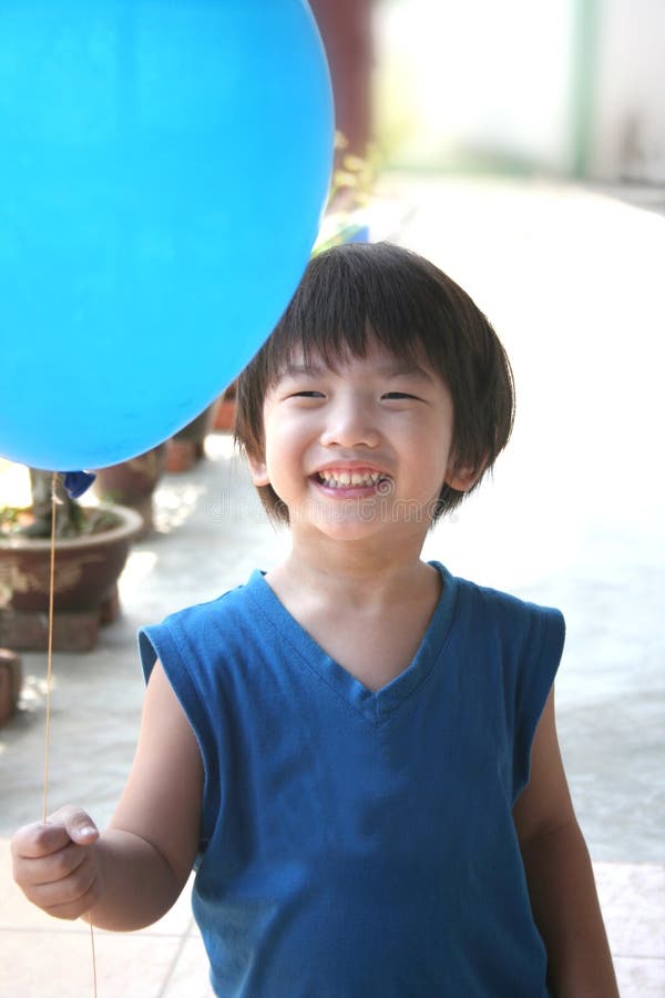 Boy holding balloon