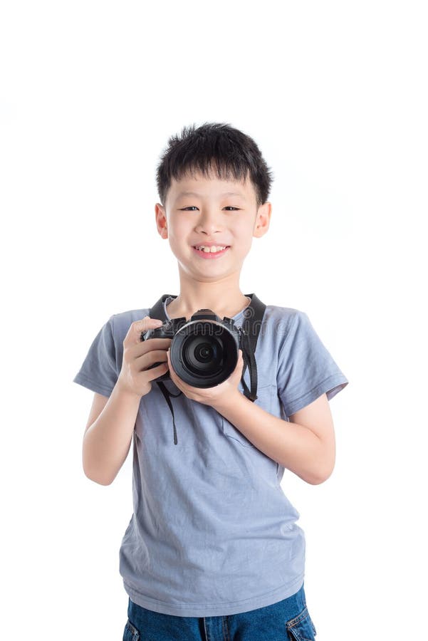 Boy holding camera over white background