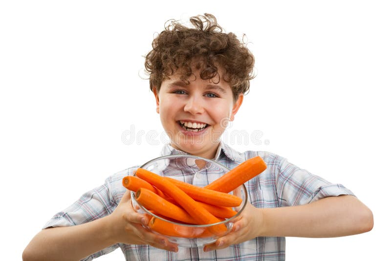 Boy holding fresh carrots