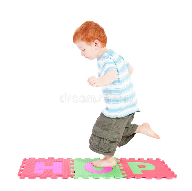 Boy hopping over word