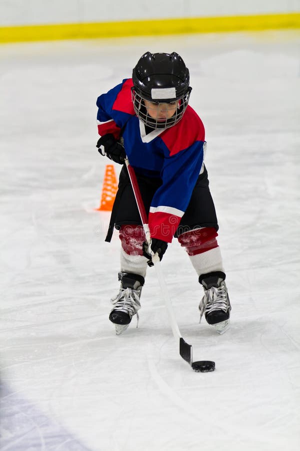 Boy Skating Backwards while Practicing Ice Hockey Stock Image Image