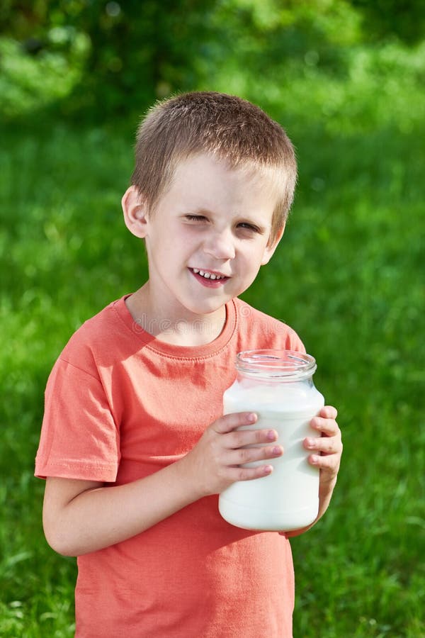 Boy with Jug of Milk in Sunny Garden Stock Image - Image of milk