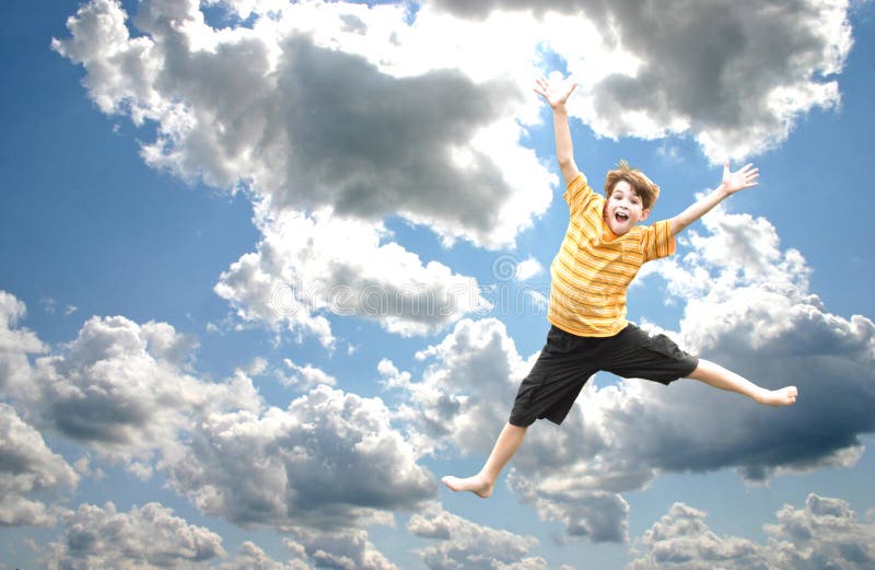 Boy Jumping in the Sky stock photography Boy Jumping in the Sky stock photography
