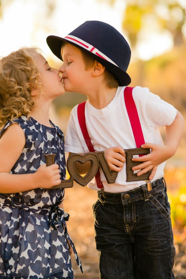 Boy kissing girl stock photo Boy kissing girl stock photo