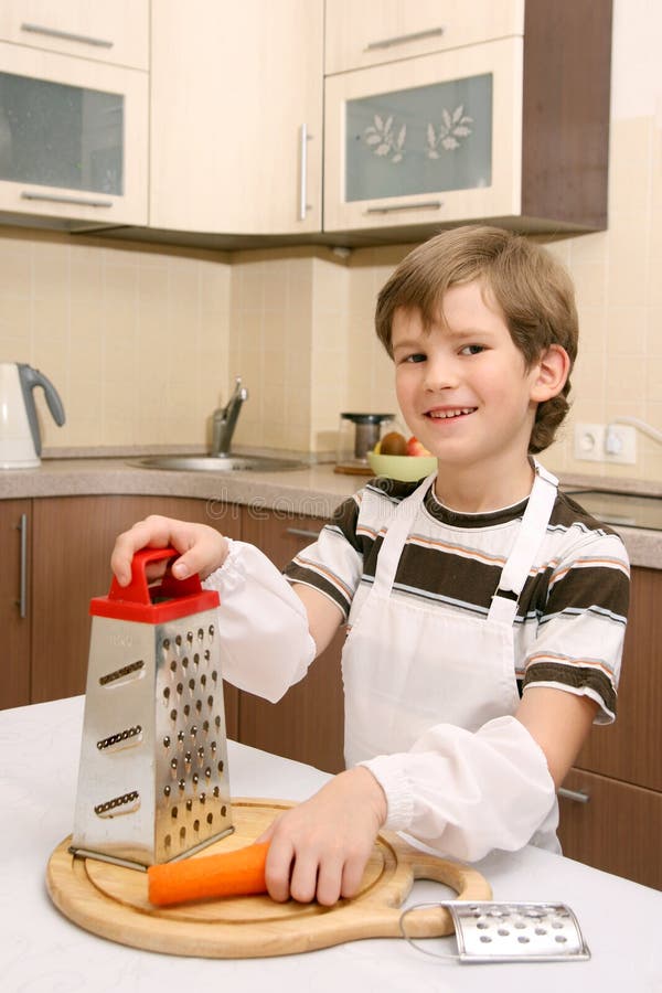 A boy in kitchen stock image. Image of small, board, child 29402957
