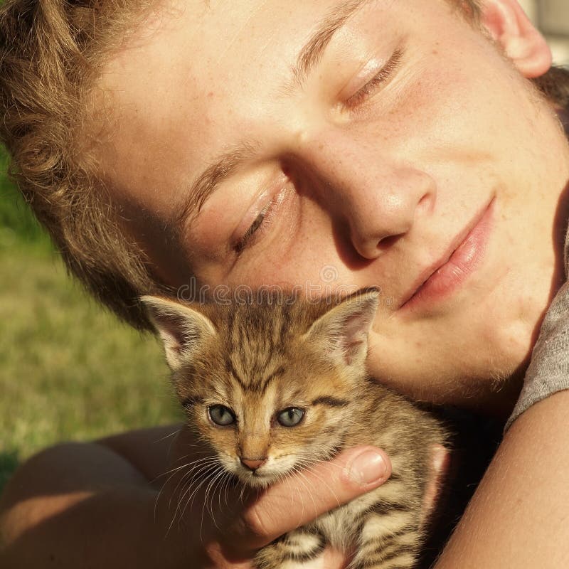 Boy with kitten stock photo. Image of teen, smile, natural 15297258