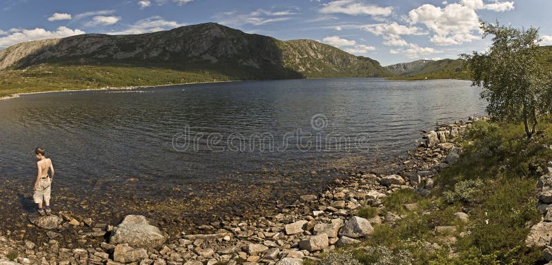 A boy by a lake