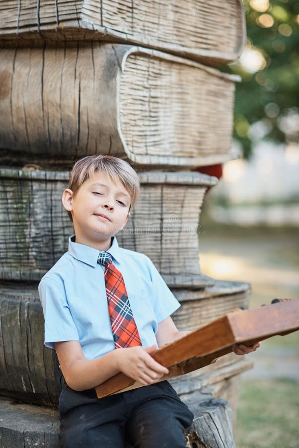 Boy with large abacus. Brown, equipment.