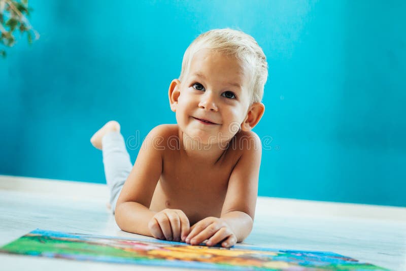 Boy learning how to solve a puzzle stock images.