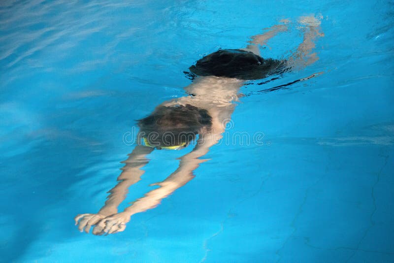 Boy Learning To Swim in Swimming Pool. Stock Photo Image of activity