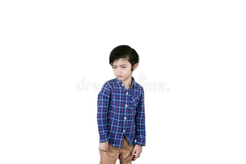Boy looking at the camera with arrogant expression stock photo