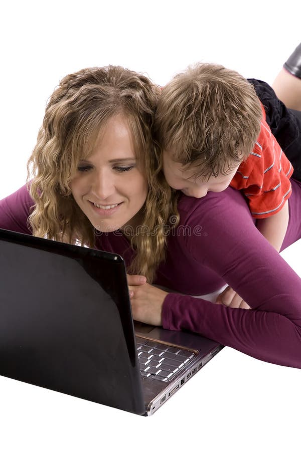 Boy looking over moms shoulder