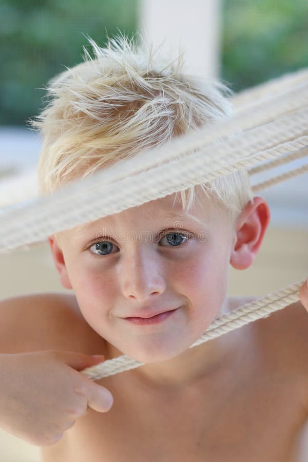 Boy Looking Between Ropes