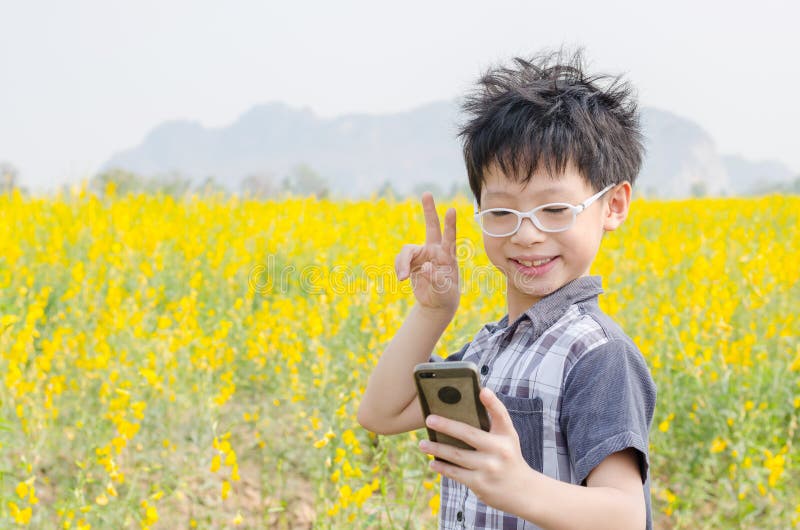 Boy making selfie portrait photo by smart phone