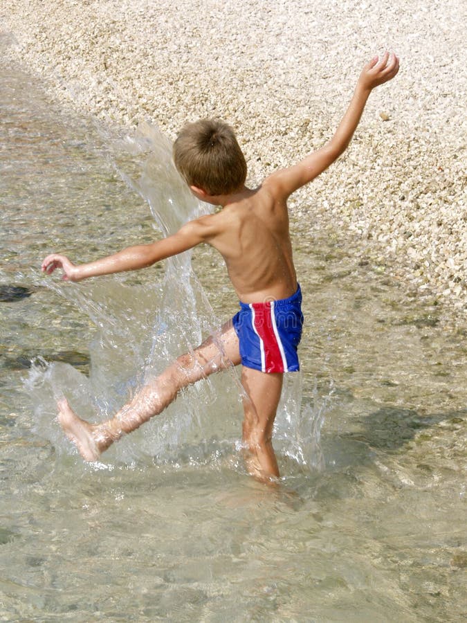 Boy making splash in the water