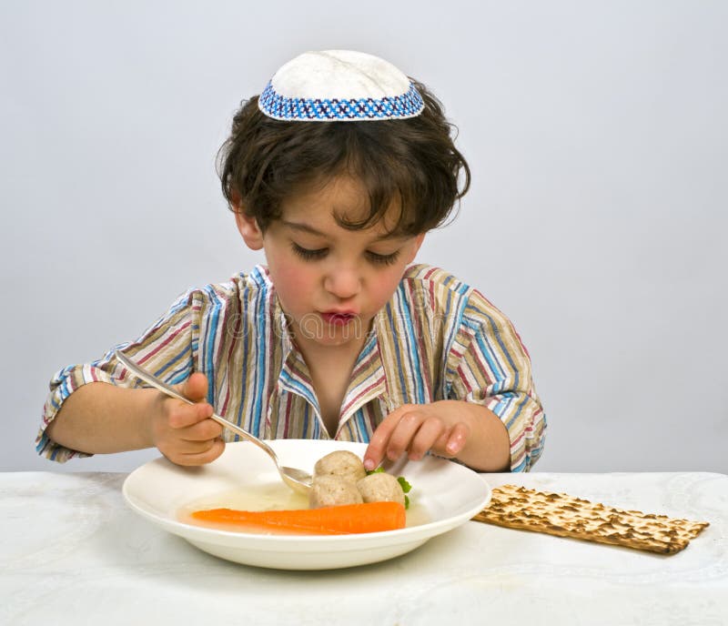Jewish young boy having matzo ball soup. Kosher stock images, royalty-free photos and pictures