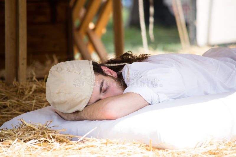 Boy with medieval costume sleeping