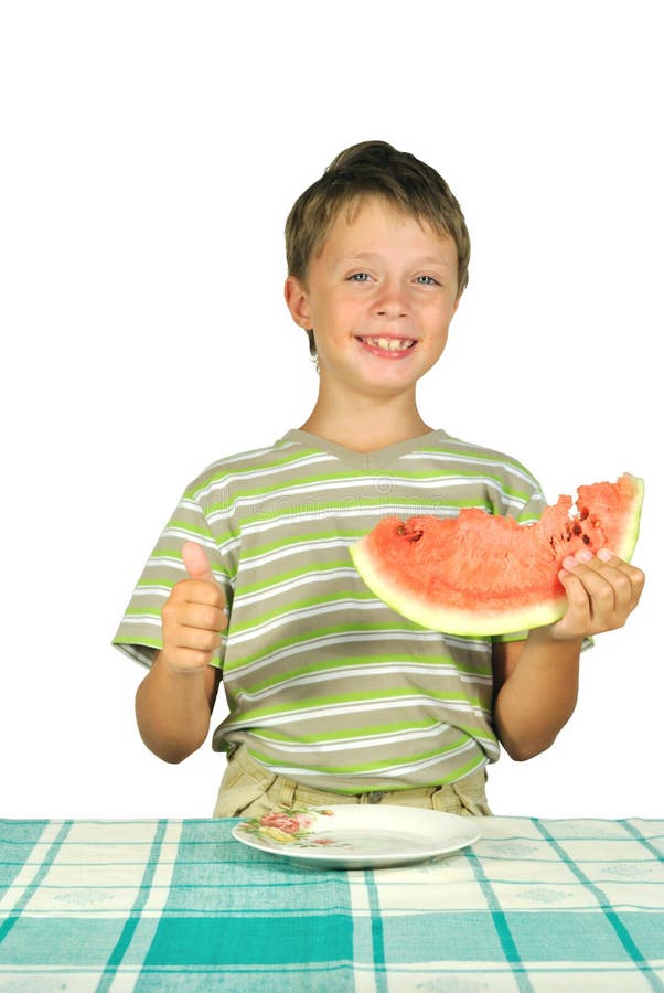 The boy with melon at the table