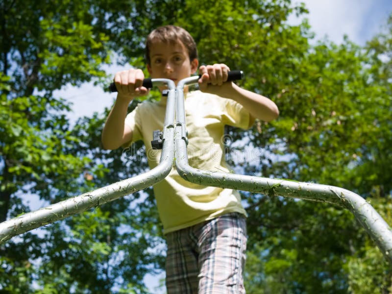 Boy mowing the lawn