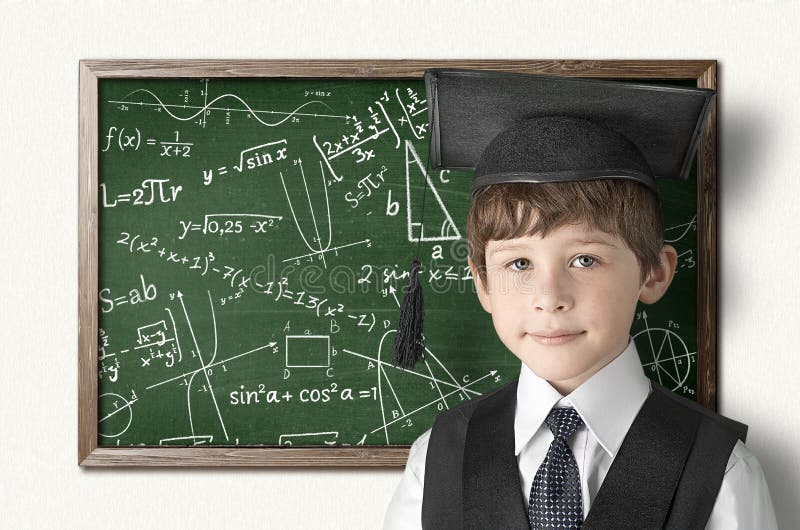 Boy near blackboard stock photo