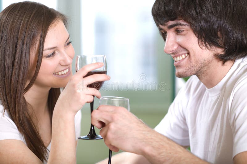 Boy with nice girl with wineglasses