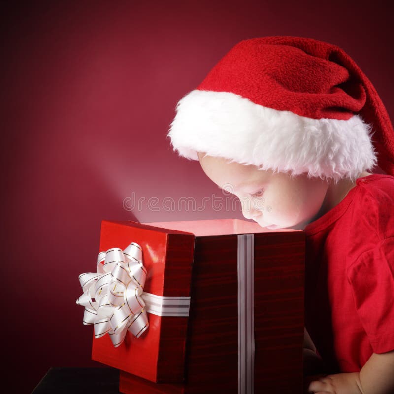 Boy open christmas gift-box stock images