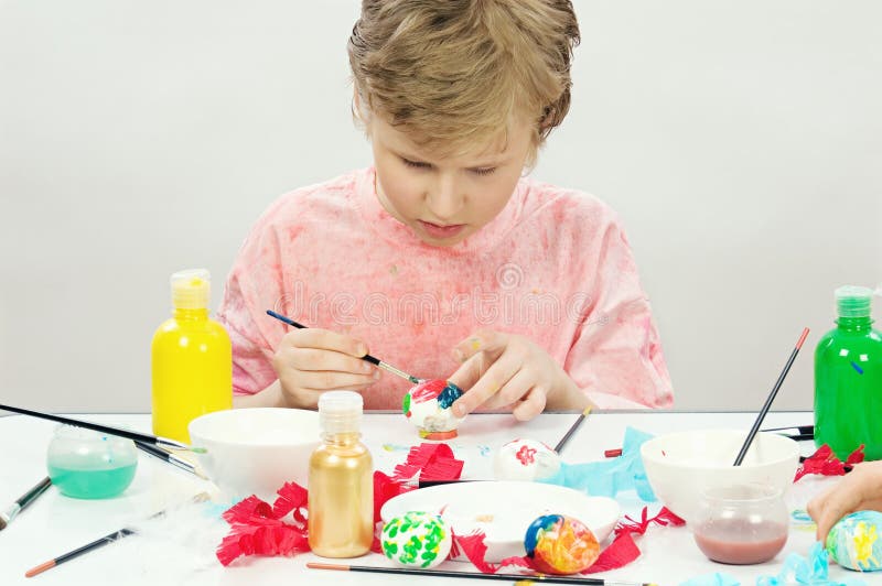 Boy painting Easter egg stock image Boy painting Easter egg stock image