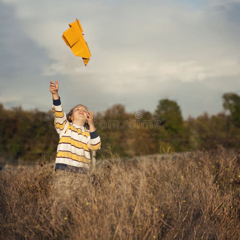 Boy with paper plane