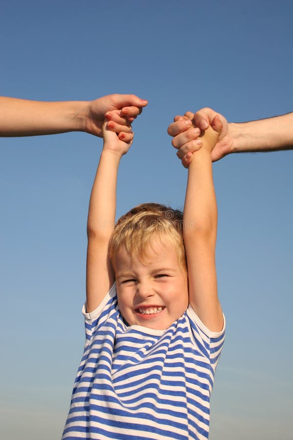 Boy with parents hands