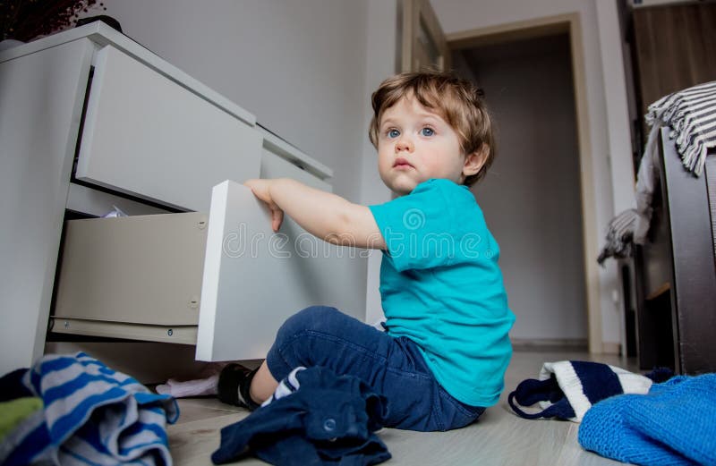 Boy Play with Clothes from Cupboard Stock Photo Image of baby, crawl