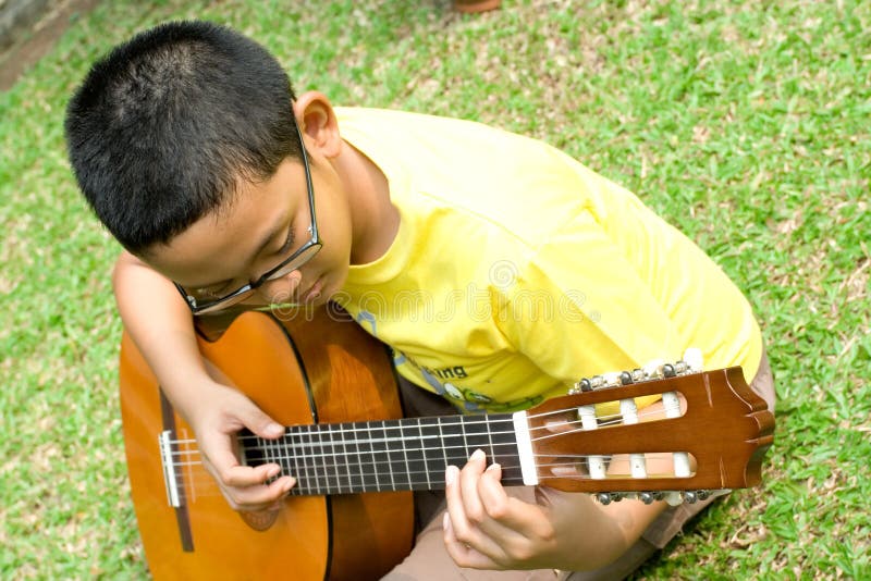 Boy play guitar