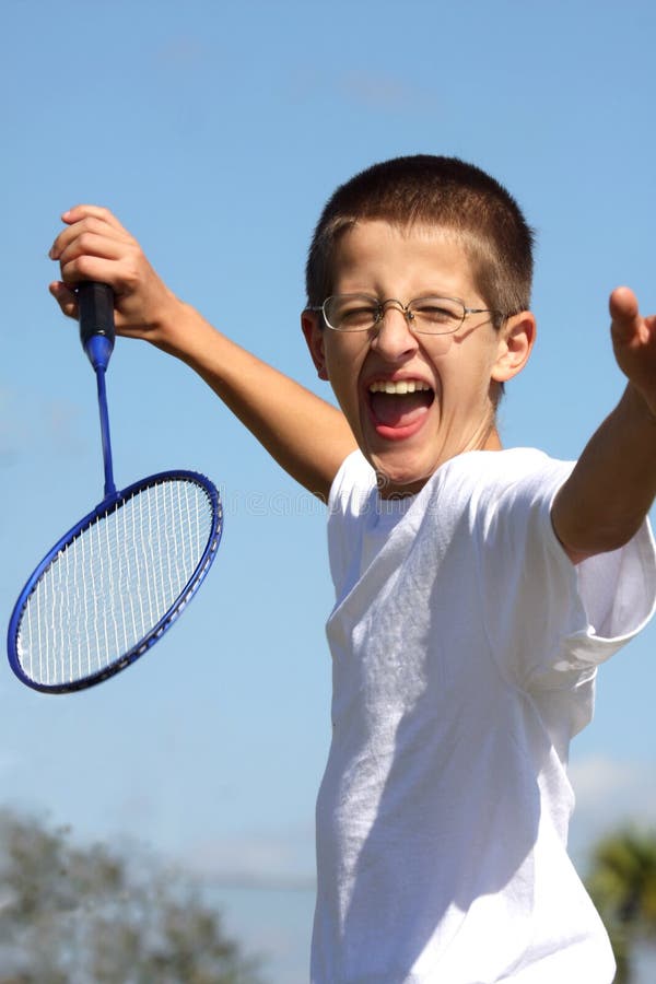 Boy playing badminton