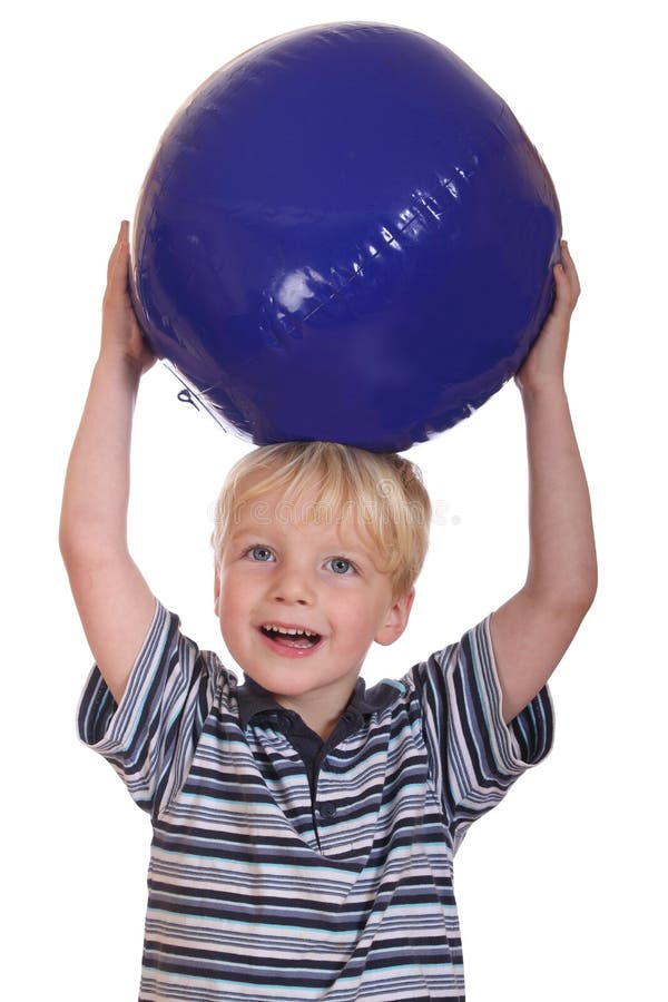 Boy Holding Big Ball Over Head Stock Photo Image of play, casual