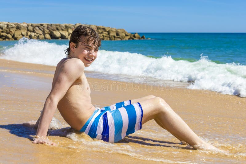 Young Boy Jumping on the Water at the Sea Stock Image - Image of purity, energy: